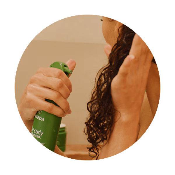 woman using be curly advanced perfecting primer